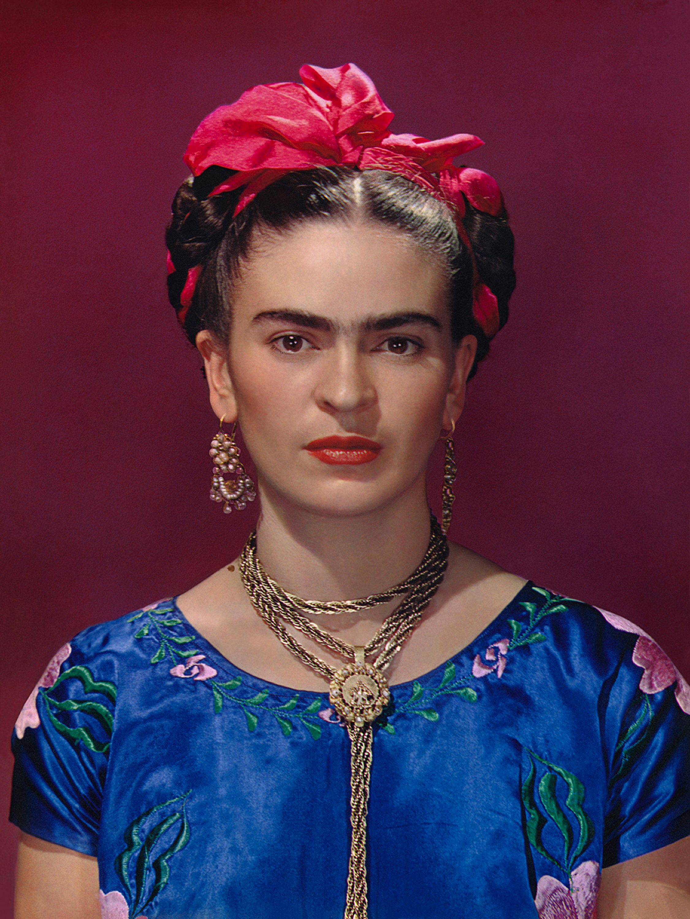 Frida Kahlo in blue satin blouse, 1939, photo graph by Nickolas Muray  © Nickolas Muray Photo  Archives.