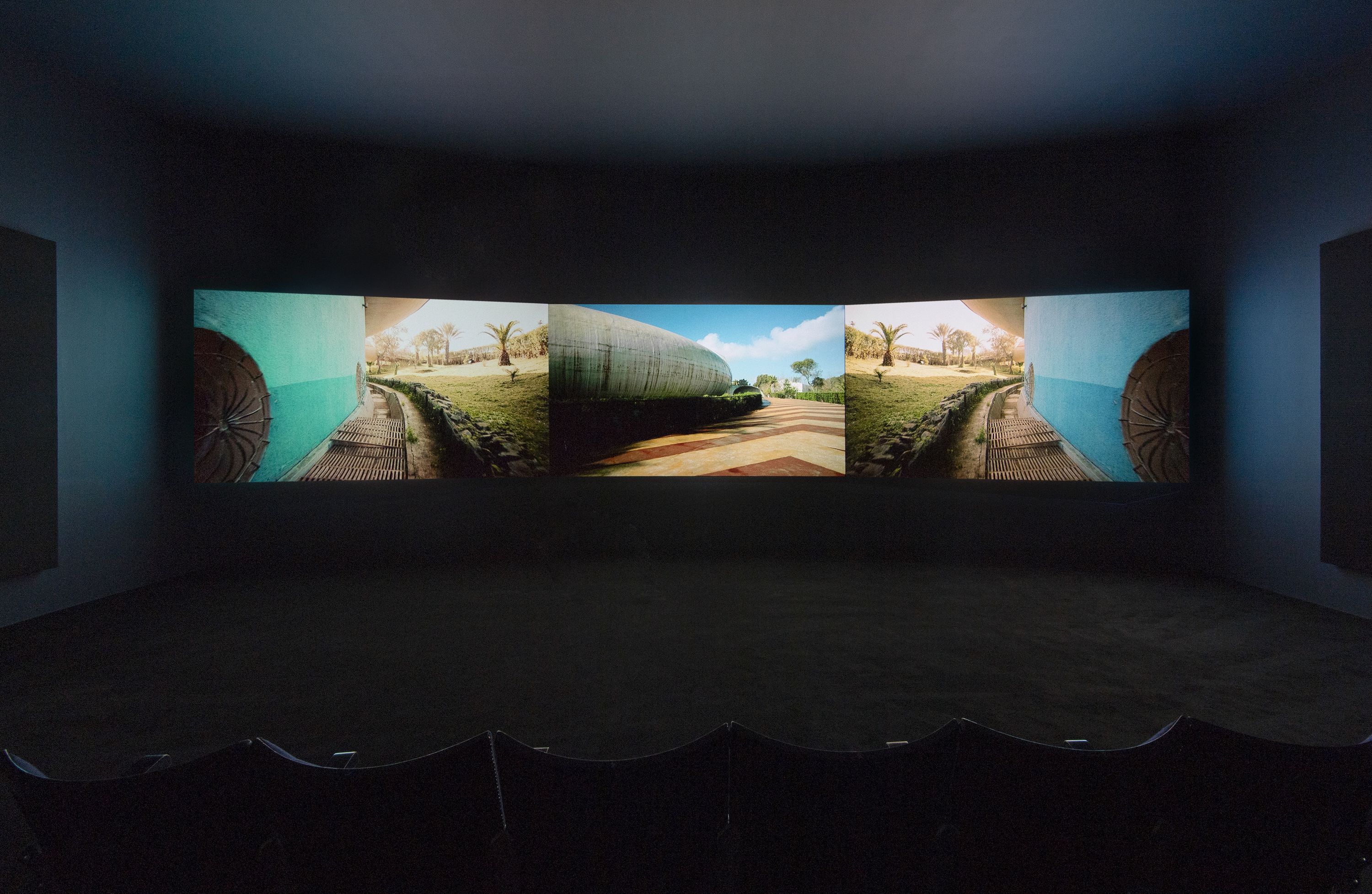 Naeem Mohaiemen, Two Meetings and a Funeral 2017, three-channel video, Turner Prize 2018 exhibition installation view, Tate Britain (26 September 2018 - 9 January 2019). Tate Photography, Matt Greenwood